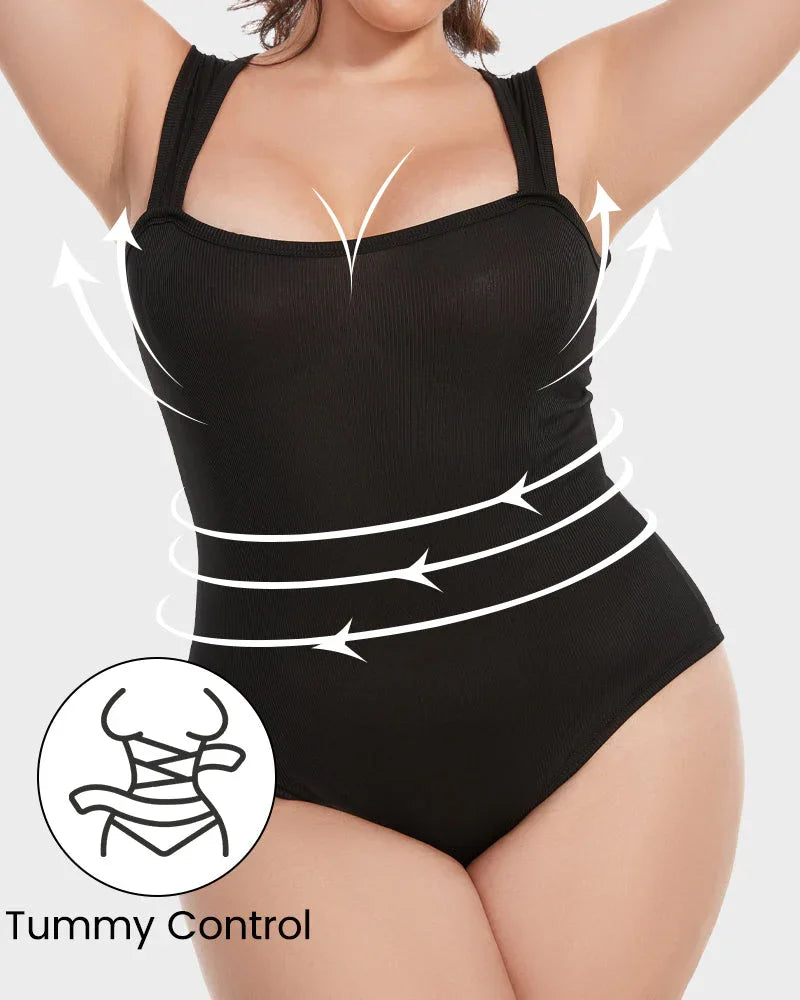 Woman wearing black shapewear bodysuit with tummy control and curve-enhancing design.