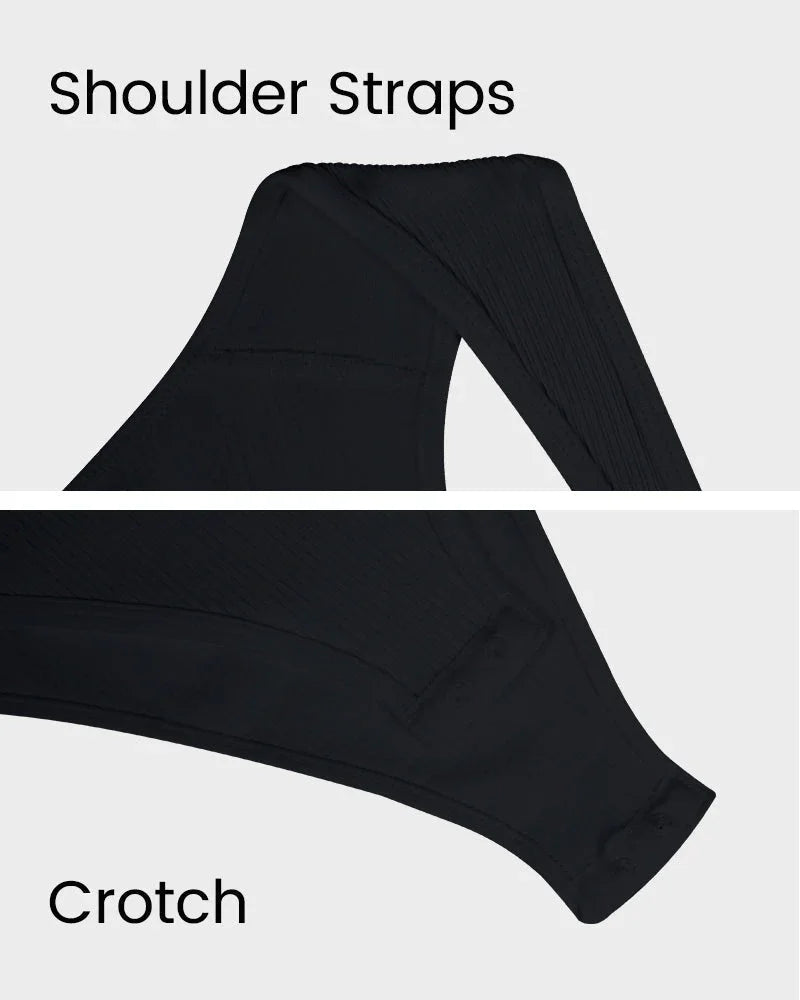 Close-up of black shapewear showing shoulder straps and crotch details on white background