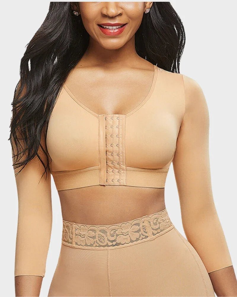 Woman wearing nude long sleeve shapewear top with front hooks and high-waist lace shapewear