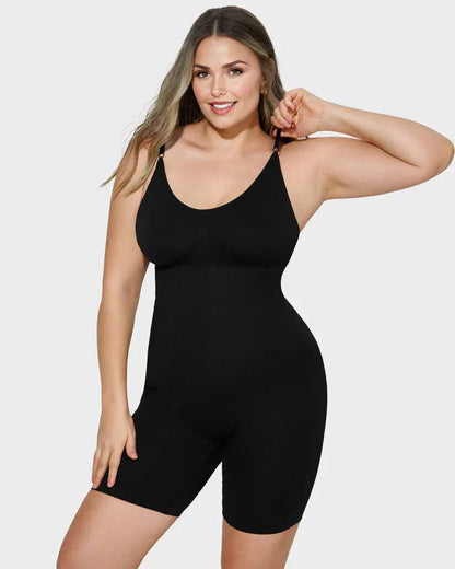 Woman modeling black shapewear bodysuit with adjustable straps on plain background