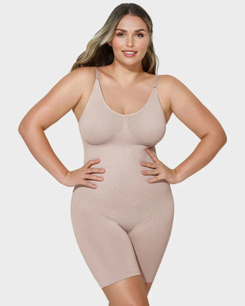 Woman modeling nude seamless shapewear bodysuit with adjustable straps on white background