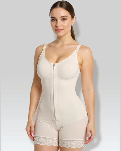 Woman wearing beige full-body shapewear with lace trim and front zipper, shapewear fashion