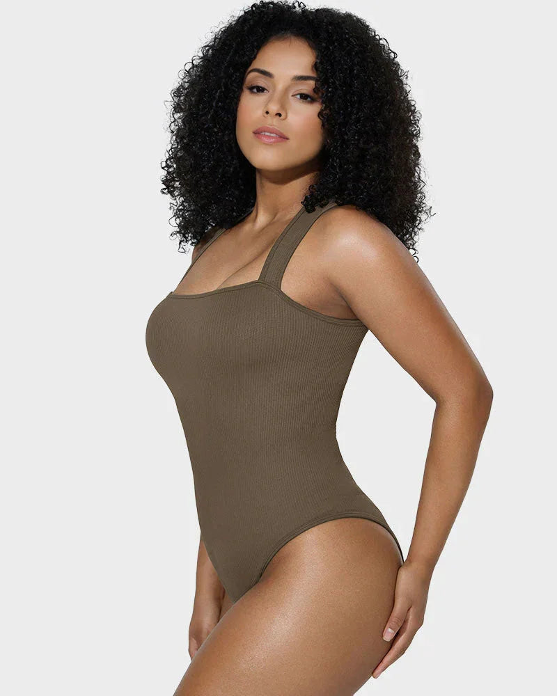 Woman modeling brown ribbed bodysuit shapewear with wide straps on white background