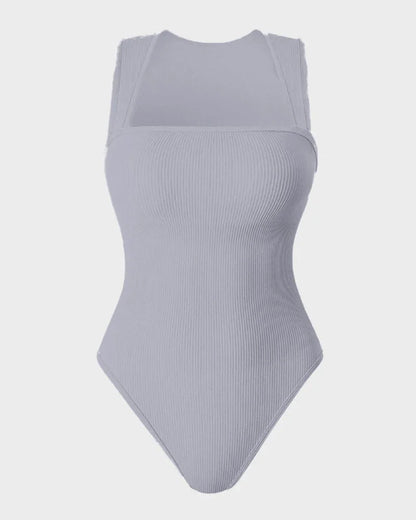 Light grey ribbed shapewear bodysuit with wide straps and scoop neckline on plain background