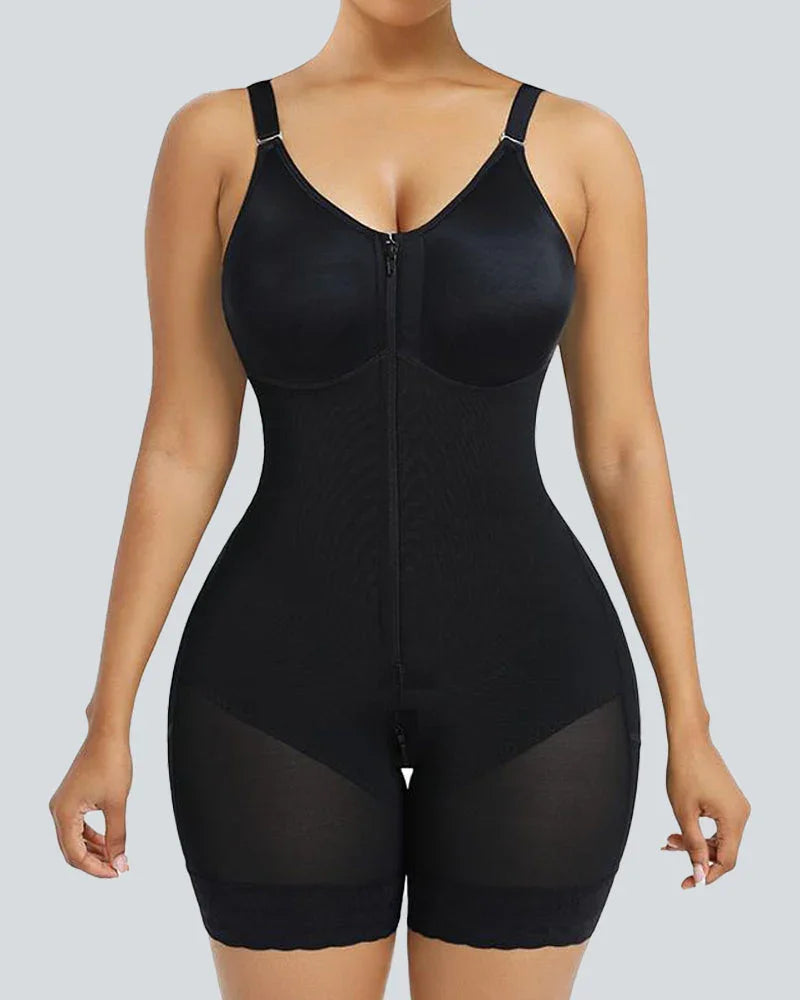 Woman wearing black full-body shapewear with adjustable straps and front zipper, front view