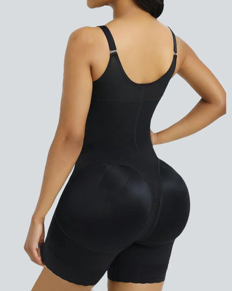 Woman wearing black full-body shapewear with adjustable straps, viewed from the back